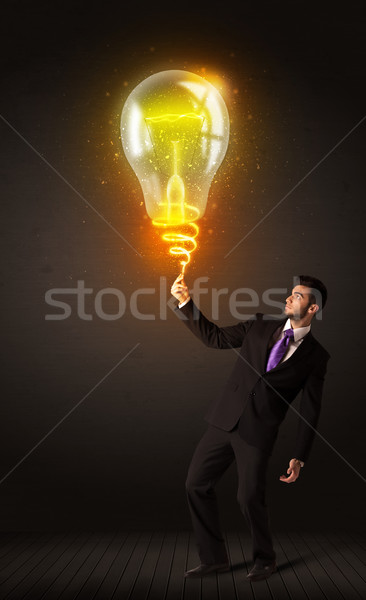 Businessman with an idea bulb Stock photo © ra2studio