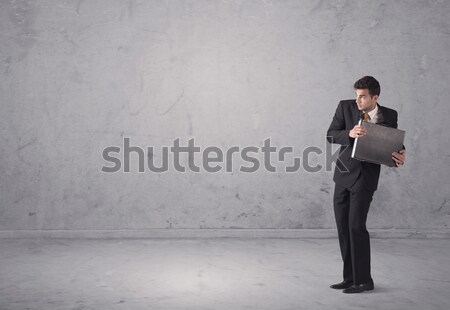 Young businessman standing confused Stock photo © ra2studio