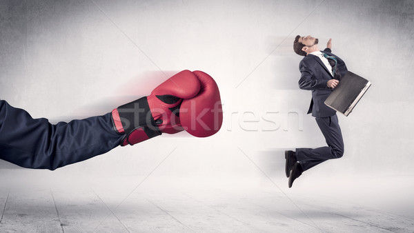 Huge Boxing Gloves punches businessman concept Stock photo © ra2studio