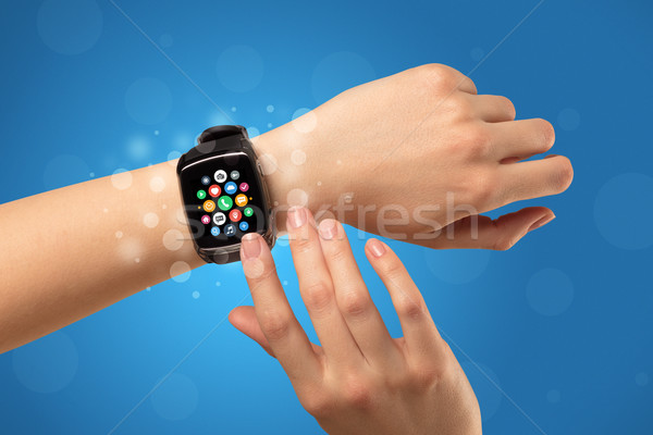 Female hand with smartwatch and app icons Stock photo © ra2studio