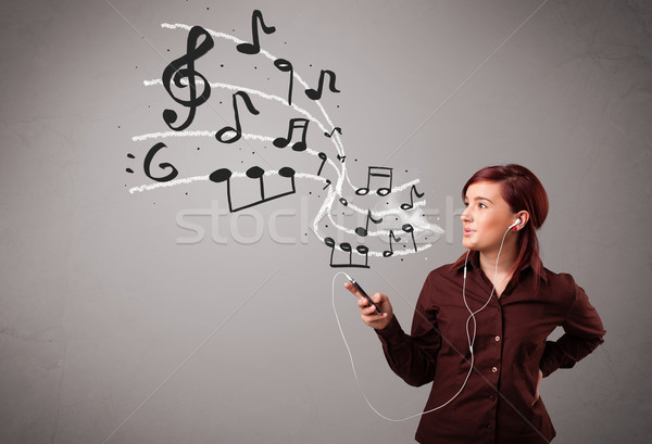 Atrakcyjny młodych pani śpiewu słuchanie muzyki muzyki zauważa Zdjęcia stock © ra2studio