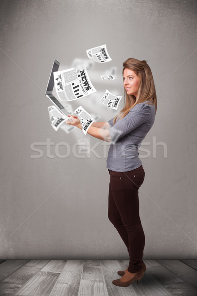 Casual pretty young woman holdin notebook and reading the explosive news Stock photo © ra2studio