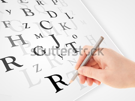Hand writing various letters on white plain paper Stock photo © ra2studio