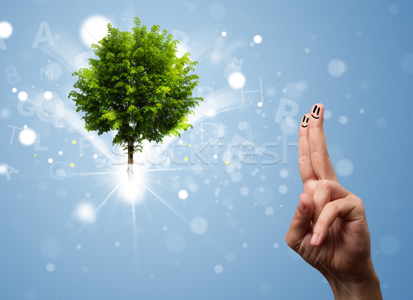 Happy finger smileys with green magical glowing tree Stock photo © ra2studio