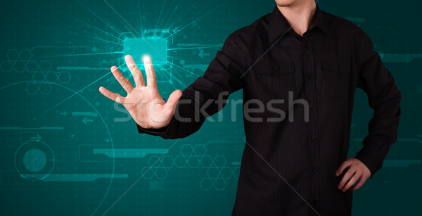 Businessman pressing high tech type of modern buttons Stock photo © ra2studio