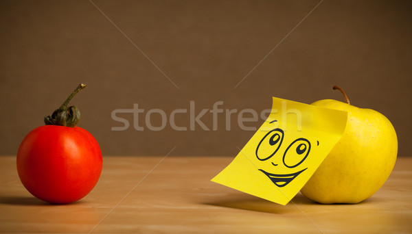 Apple with post-it note looking at tomato Stock photo © ra2studio