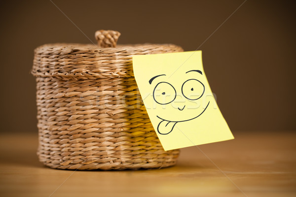 Post-it note with smiley face sticked on a jewelry box Stock photo © ra2studio