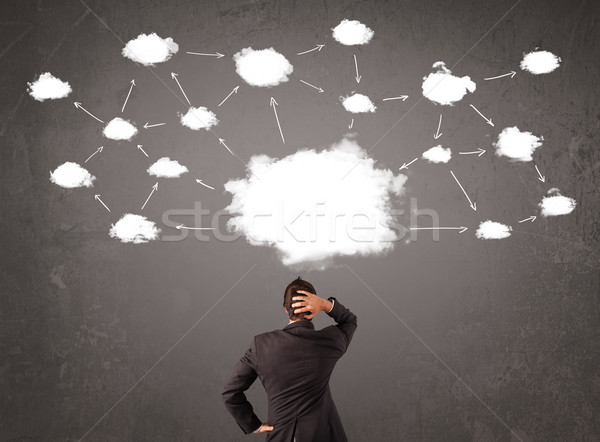 Stock photo: Businessman sitting with cloud technology above his head