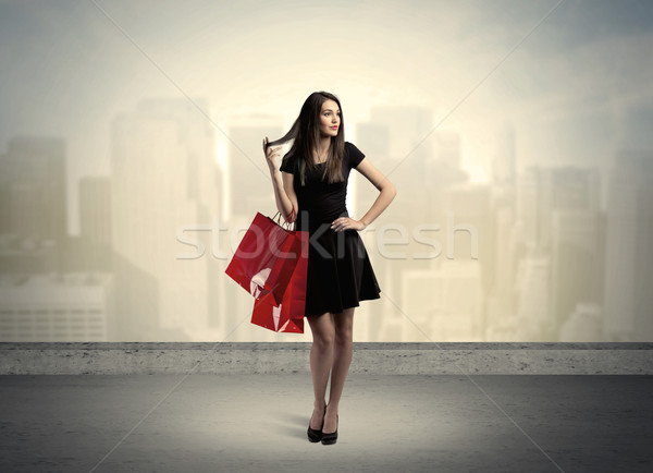 City woman standing with shopping bags Stock photo © ra2studio