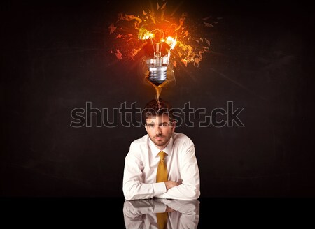 üzletember ül fúj ötlet villanykörte lehangolt Stock fotó © ra2studio