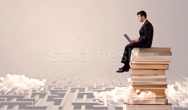 Uomo tablet seduta libri imprenditore laptop Foto d'archivio © ra2studio