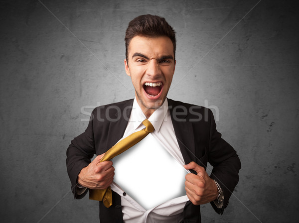 Businessman tearing off his shirt with white copyspace on chest Stock photo © ra2studio