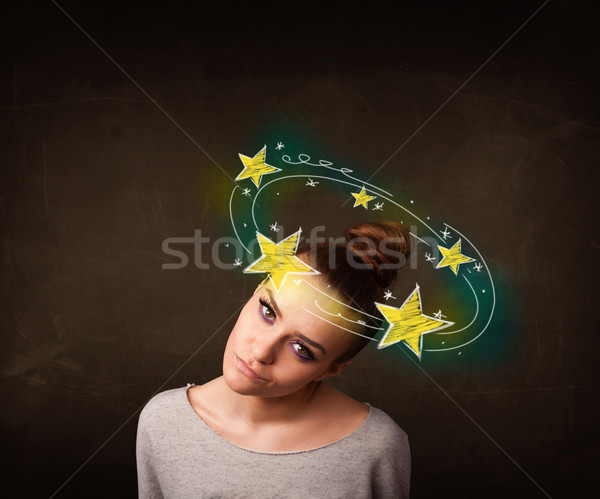 girl with yellow stars circleing around her head illustration Stock photo © ra2studio