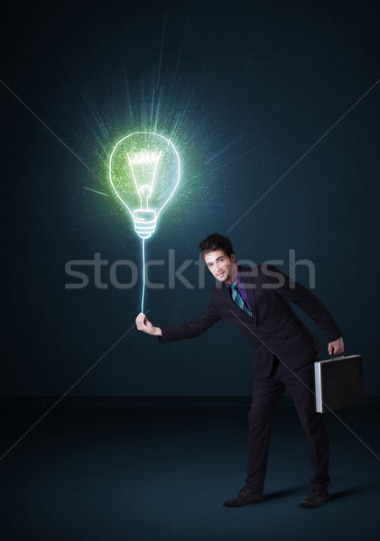 Businessman with an idea bulb Stock photo © ra2studio