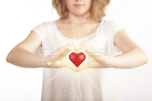 Hands creating a form with shining heart Stock photo © ra2studio