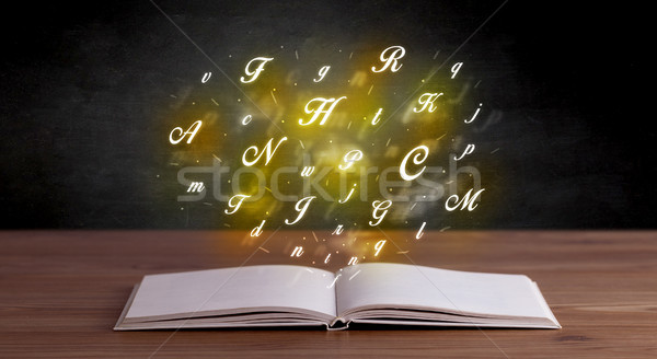 Alphabet letters over book  Stock photo © ra2studio