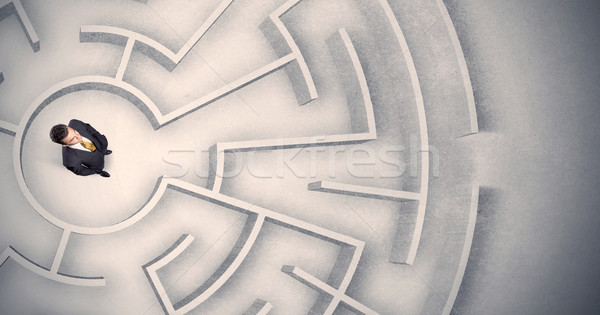 Business man trapped in a circular maze Stock photo © ra2studio