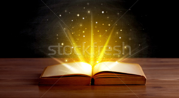 Yellow lights over book Stock photo © ra2studio