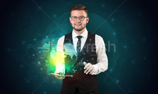 Spectacled businessman with tablet and apps above Stock photo © ra2studio