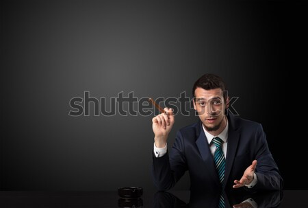 Stock photo: Young man smoking cigarette with copy space