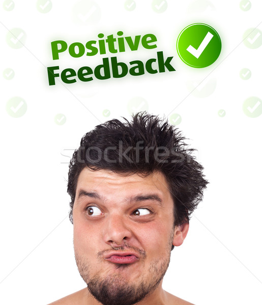 Young head looking at positive negative signs Stock photo © ra2studio