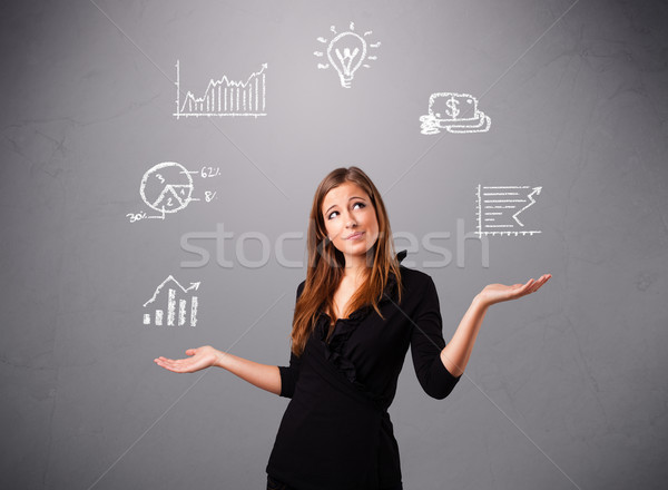 beautiful young woman juggling with statistics and graphs Stock photo © ra2studio