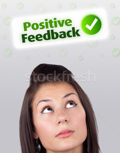 Young girl looking at positive negative signs Stock photo © ra2studio