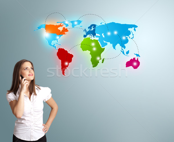 young woman making phone call with colorful world map Stock photo © ra2studio