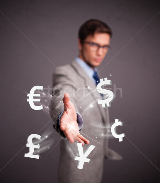 Stock photo: Attractive man throwing currency icons