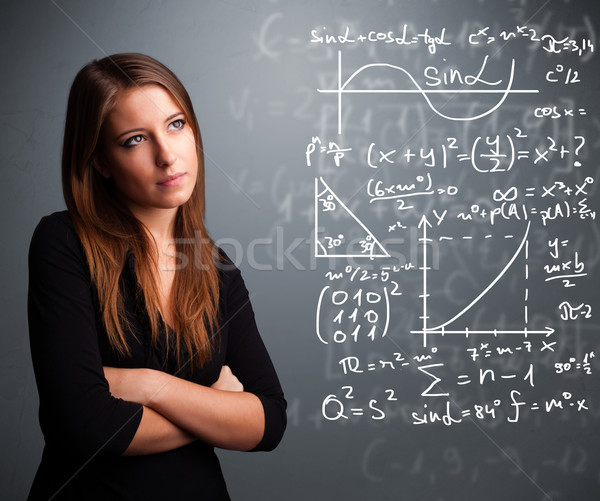 Beautiful school girl thinking about complex mathematical signs Stock photo © ra2studio