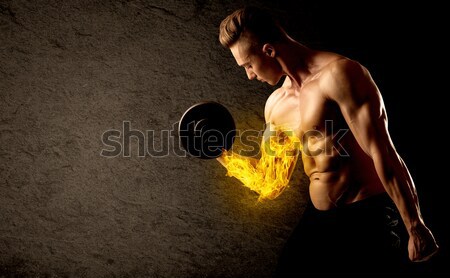 Bodybuilder lifting weight with energetic white lines concept Stock photo © ra2studio