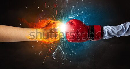 Bodybuilder athlete lifting weight with fire explode arm concept Stock photo © ra2studio