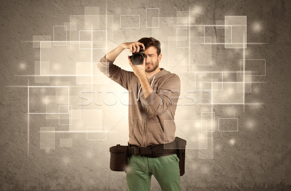 Male holdig professional camera with lens Stock photo © ra2studio