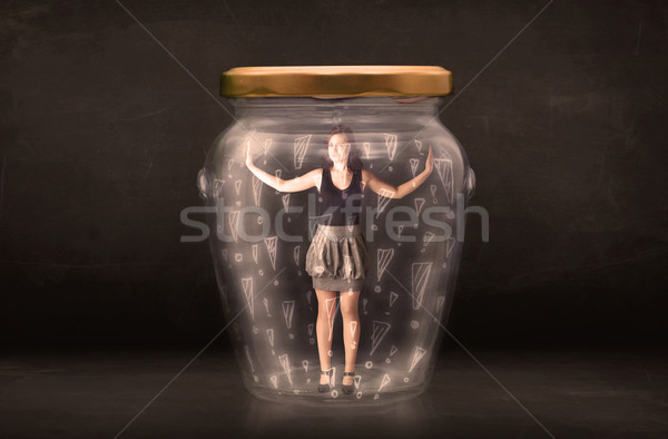 Business woman trapped in jar with exclamation marks concept Stock photo © ra2studio
