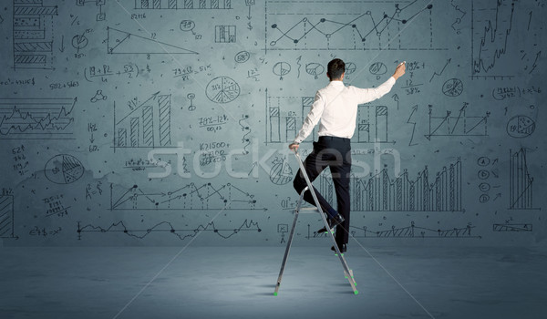 Man on ladder drawing charts Stock photo © ra2studio