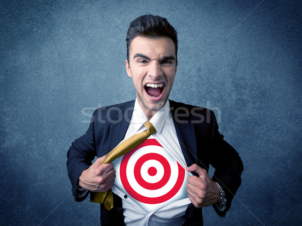 Businessman tearing shirt with target sign on his chest Stock photo © ra2studio