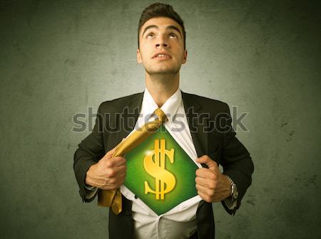 Stock photo: Businessman tearing off his shirt with dollar sign on chest