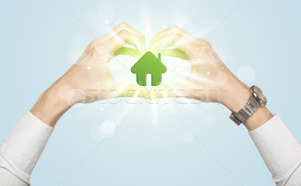 Hands creating a form with green house Stock photo © ra2studio