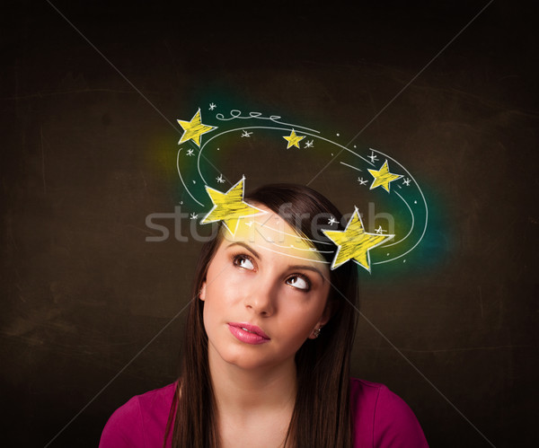 girl with yellow stars circleing around her head illustration Stock photo © ra2studio