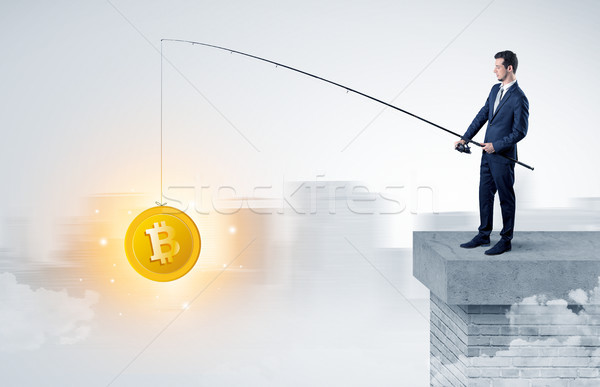 Businessman fishing coins concept Stock photo © ra2studio