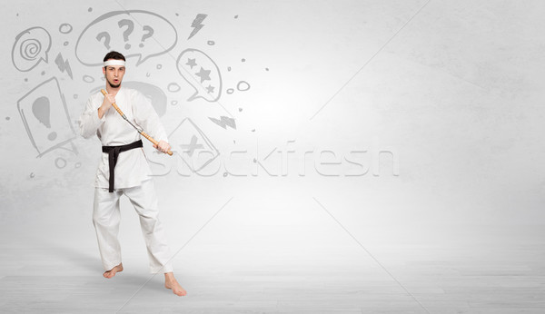 Stock photo: Karate trainer fighting with doodled symbols concept