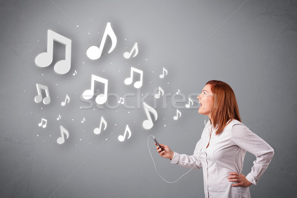 Csinos fiatal nő énekel zenét hallgat hangjegyek ki Stock fotó © ra2studio