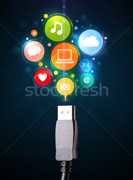 Social media icons coming out of electric cable Stock photo © ra2studio