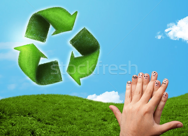 Happy smiley fingers looking at green leaf recycle sign Stock photo © ra2studio