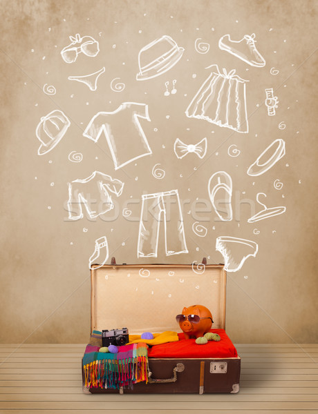 Traveler luggage with hand drawn clothes and icons Stock photo © ra2studio