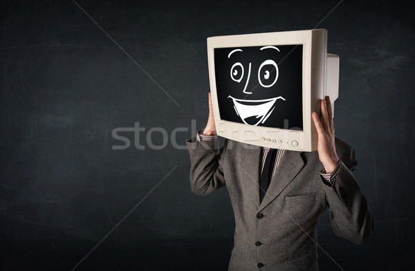 Happy businessman with a PC monitor head and a smiley face Stock photo © ra2studio