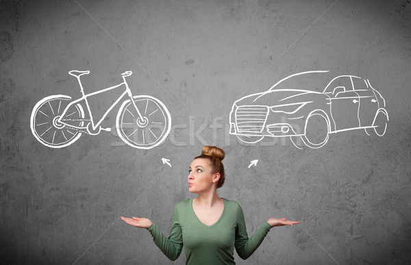 Woman making a choice between bicycle and car Stock photo © ra2studio