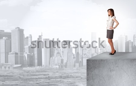 Businesswoman standing on the edge of rooftop Stock photo © ra2studio