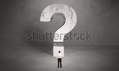 Confused businessman and big question mark Stock photo © ra2studio