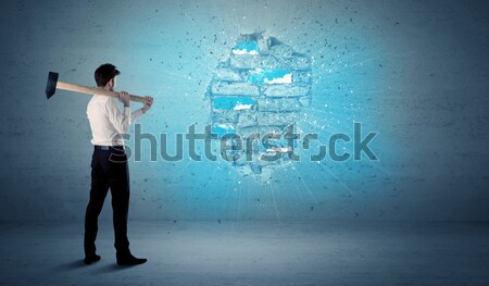 Business man hitting brick wall with huge hammer Stock photo © ra2studio